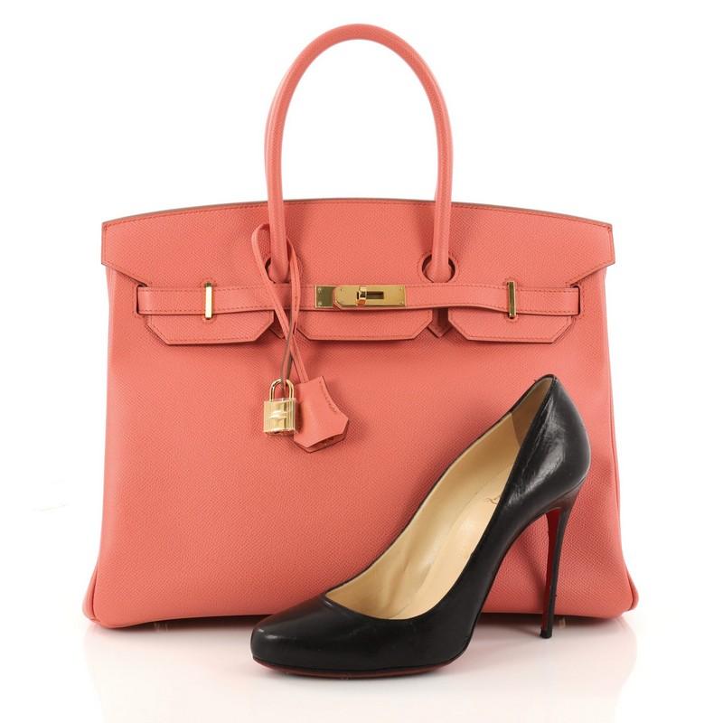 This authentic Hermes Birkin Handbag Flamingo Epsom with Gold Hardware 35 stands as one of the most-coveted accessory made for the modern woman. Crafted from Flamingo epsom leather, this stand-out tote features dual-rolled top handles, frontal flap,