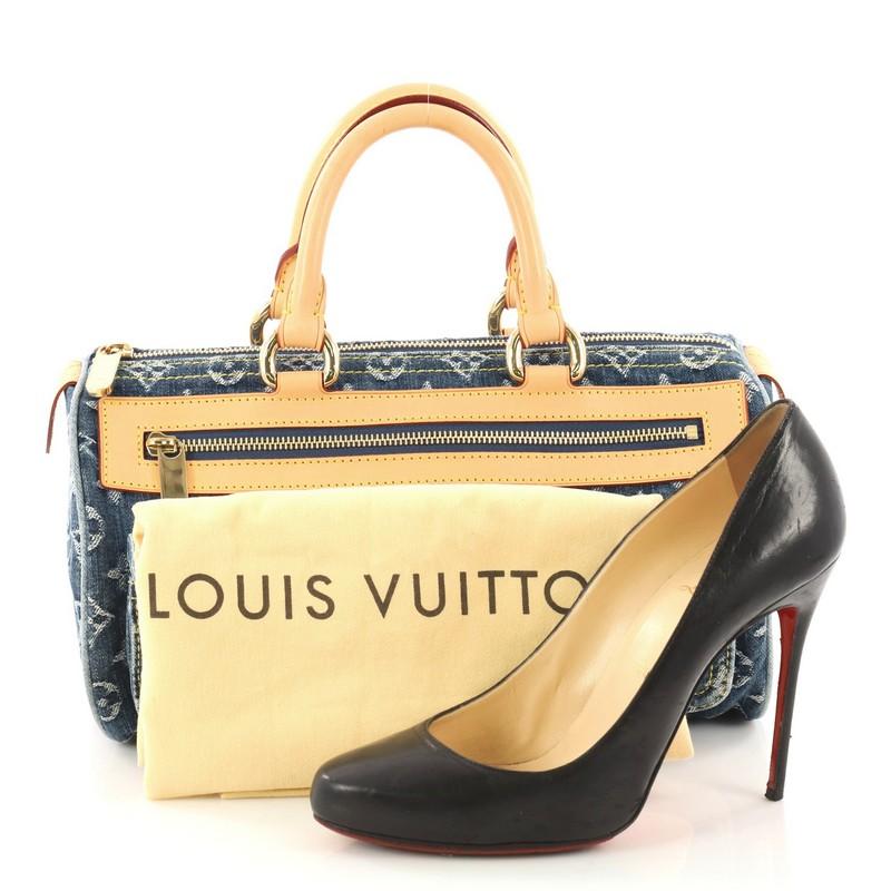 This authentic Louis Vuitton Neo Speedy Bag Denim is a playfully chic piece to accessorize with casual looks. This unique top handle bag features washed denim exterior with Louis Vuitton's signature monogram print, cowhide leather handles and trims,
