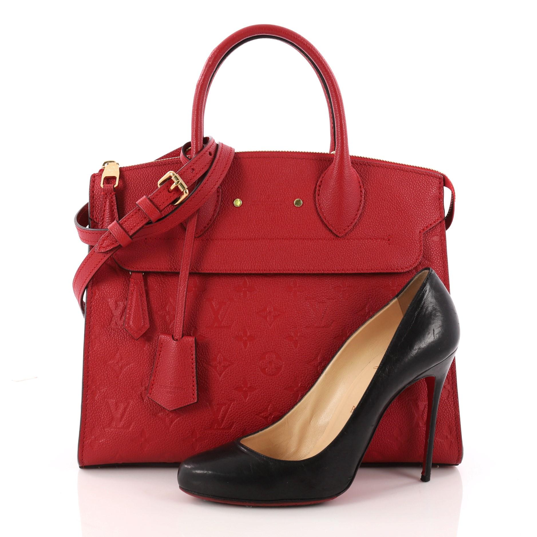 This authentic Louis Vuitton Pont Neuf Handbag Monogram Empreinte Leather MM is a modern structured bag. Constructed in sturdy red monogram empreinte leather, this simple and functional bag showcases dual rolled leather handles, protective base