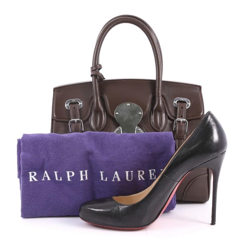 This authentic Ralph Lauren Collection Soft Ricky Handbag Leather 27 is one of the brand's most beloved styles. Crafted from brown leather, this understated tote features a boxy silhouette, a folded top with a slide-lock clasp and belted closures,