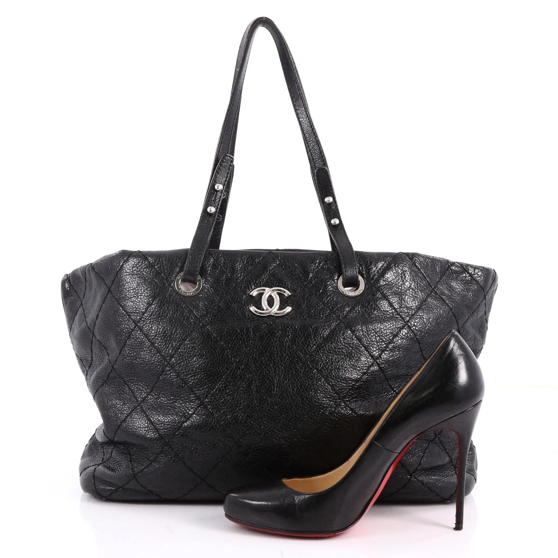 This authentic Chanel On The Road Tote Quilted Leather Small showcases the brand's classic style with everyday functionality perfect for the modern woman. Crafted from black diamond quilted leather, this tote features dual flat leather handles,