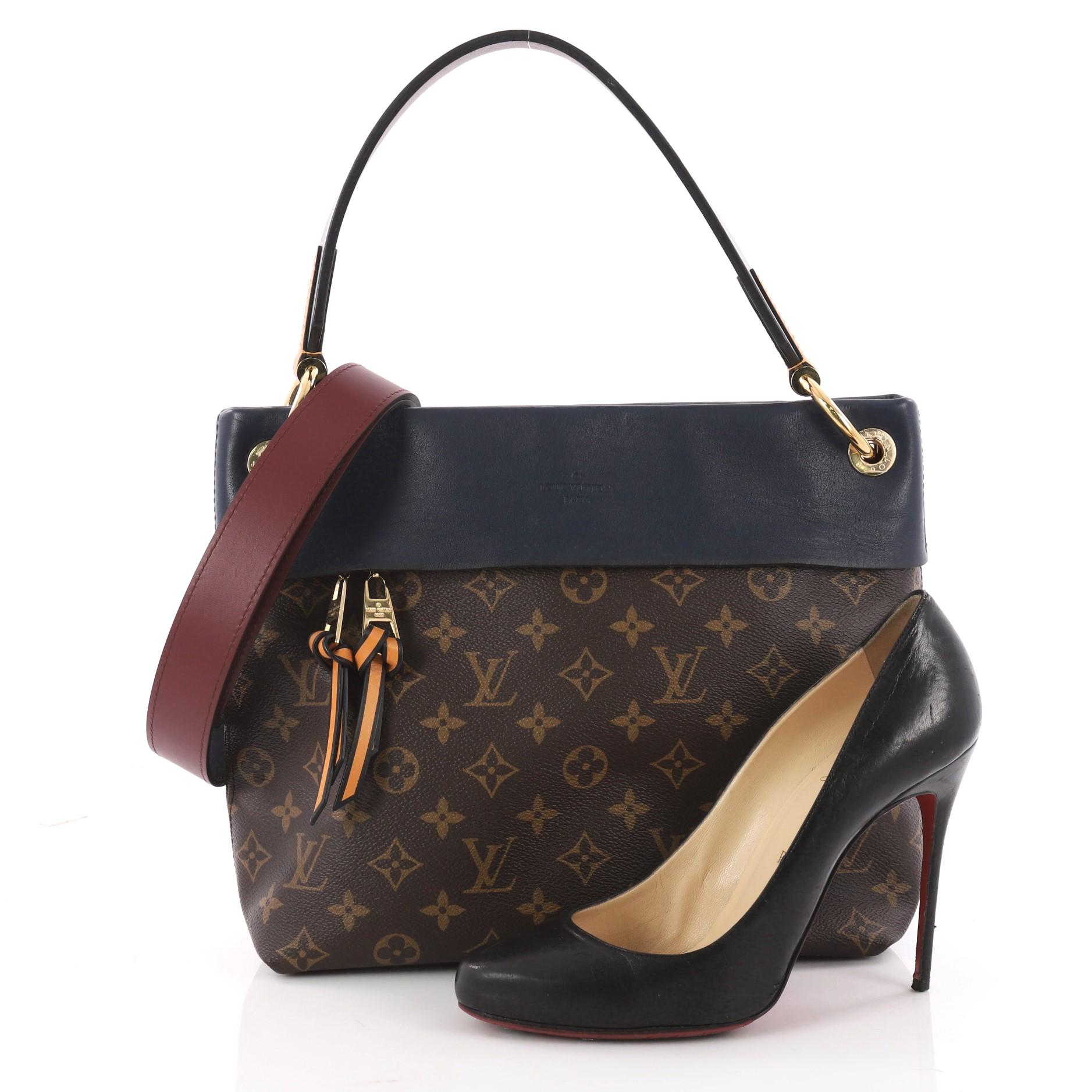 This authentic Louis Vuitton Tuileries Besace Bag Monogram Canvas with Leather was inspired by the Tuileries Gardens in Paris. Crafted from brown monogram coated canvas with leather trims, this ultra-functional bag features flat leather handle, long