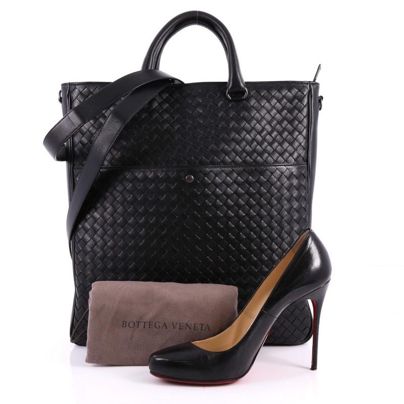 This authentic Bottega Veneta Convertible Tote Intrecciato Nappa Large is a uniquely designed and crafted tote. Constructed from black nappa leather with intrecciato detailing, this chic tote features dual-rolled leather handles, exterior front snap