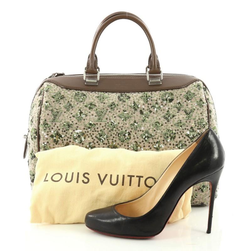 This authentic Louis Vuitton Speedy Handbag Limited Edition Sunshine Express 30 is a glittery twist on the classic speedy design. Crafted from taupe wool and embellished green embroidered luminous sequins, this bag features dual-rolled leather