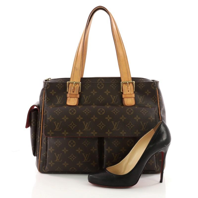 This authentic Louis Vuitton Multipli Cite Handbag Monogram Canvas showcases a simple design made for everyday use. Crafted from Louis Vuitton's iconic brown monogram coated canvas, this tote features dual flat vachetta leather straps with buckle