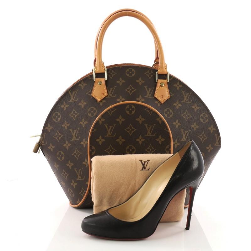 This authentic Louis Vuitton Ellipse Bag Monogram Canvas MM is uniquely structured, perfect for the modern fashionista. Crafted from the brand's iconic brown monogram coated canvas, this bowler-shape bag features natural cowhide leather trims,