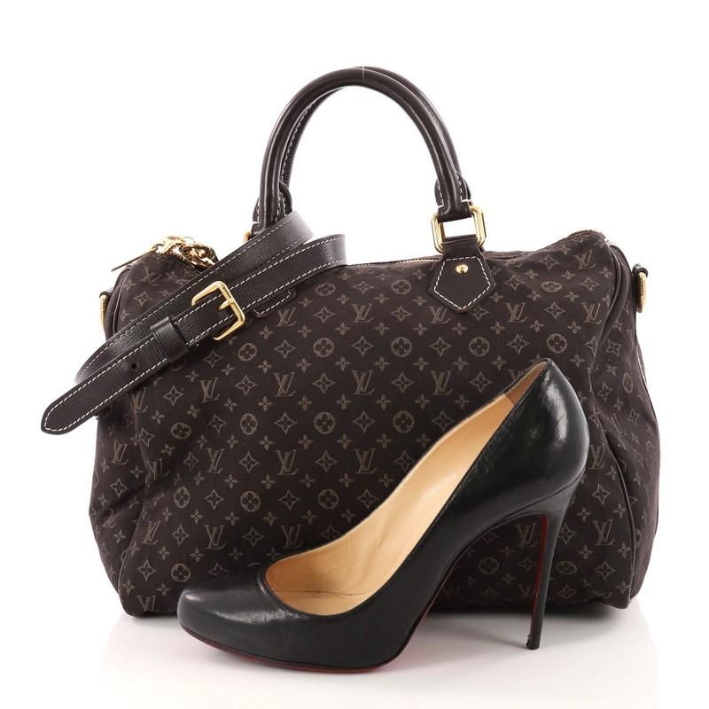This authentic Louis Vuitton Speedy Bandouliere Bag Monogram Idylle 30 is a sporty must-have. Constructed from Louis Vuitton's brown monogram idylle fabric, this fresh Speedy features dual rolled top handles, dark brown leather piping, and gold-tone