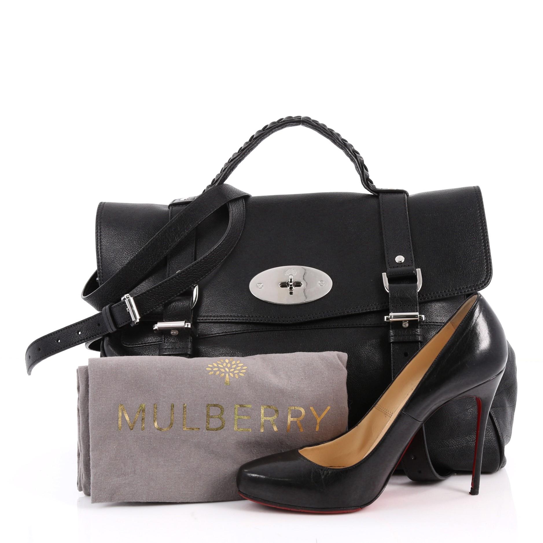 This authentic Mulberry Alexa Satchel Polished Buffalo Medium depicts a stylish and functional style made for fashionistas. Crafted from black polished buffalo leather, this oversized satchel features a braided top handle, fold over flap with