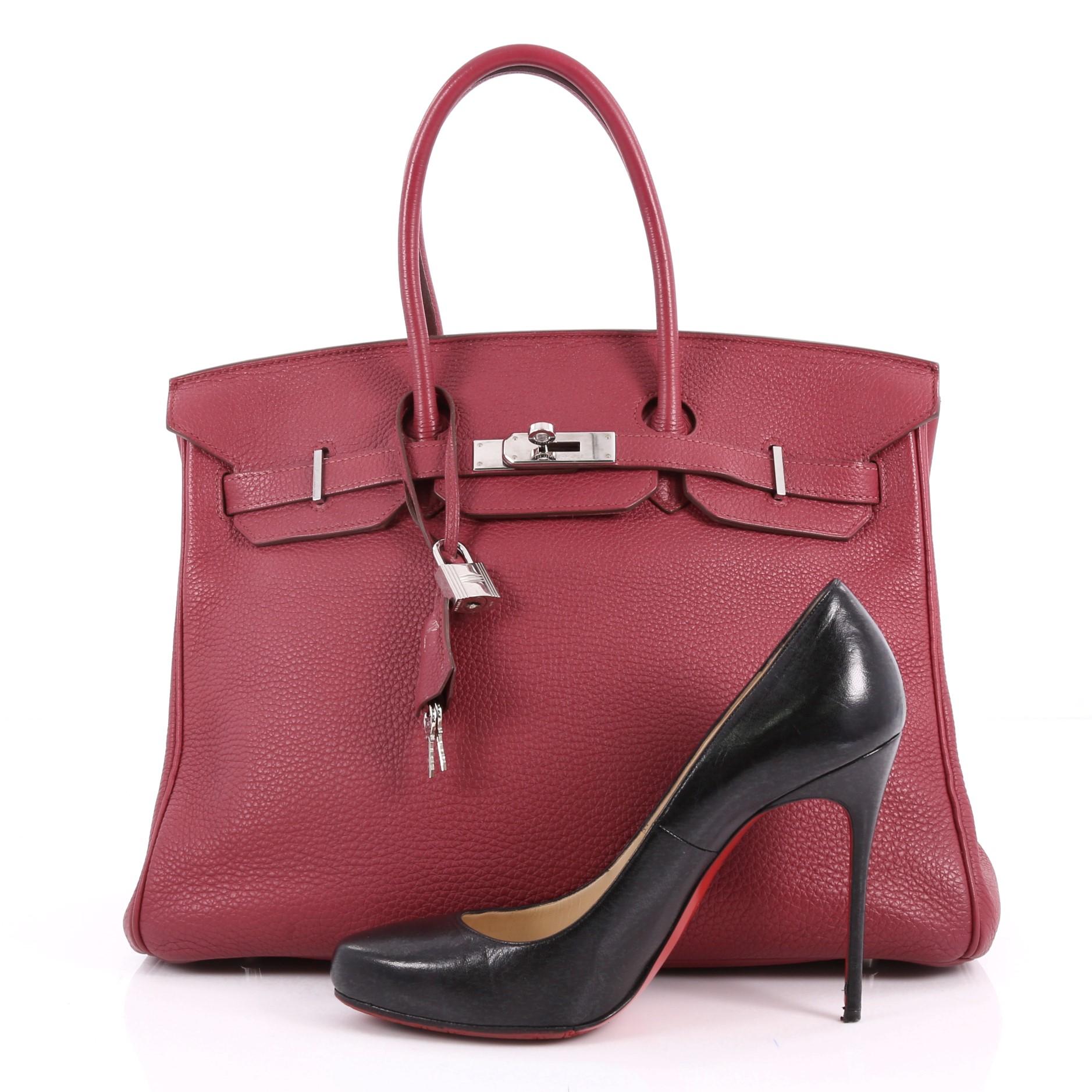 This authentic Hermes Birkin Handbag Rubis Togo with Palladium Hardware 35 stands as one of the most-coveted bags. Constructed from scratch-resistant, iconic rubis togo leather, this stand-out tote features dual-rolled top handles, frontal flap,