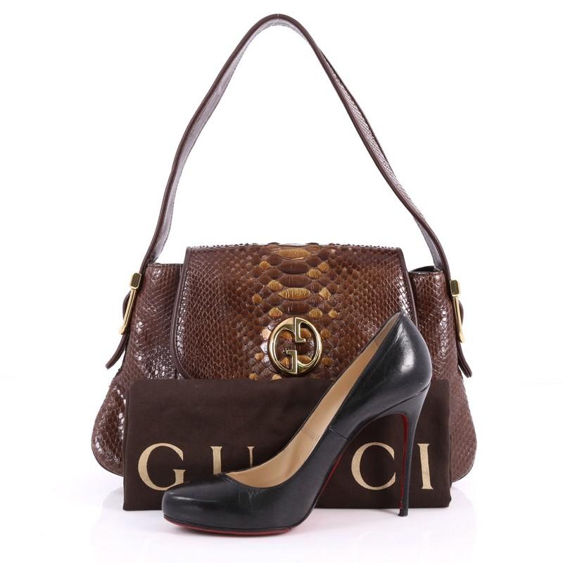 This authentic Gucci 1973 Satchel Python Medium is a classic for Gucci lovers. Crafted in brown genuine python skin, this vintage-inspired bag features a front flap with the brand's classic double G emblem detail, flat python skin handle and