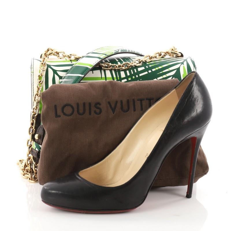 This authentic Louis Vuitton Twist Handbag Limited Edition Palm Print Leather with Monogram Canvas MM is from the brand's Cruise 2016 runway collection. Crafted in green palm print leather with brown monogram coated canvas this chic bag features