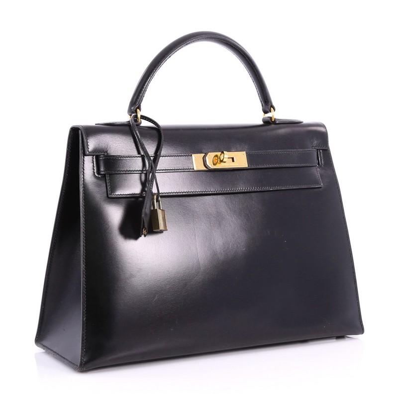 Hermes Kelly Handbag Black Box Calf with Gold In Good Condition In NY, NY
