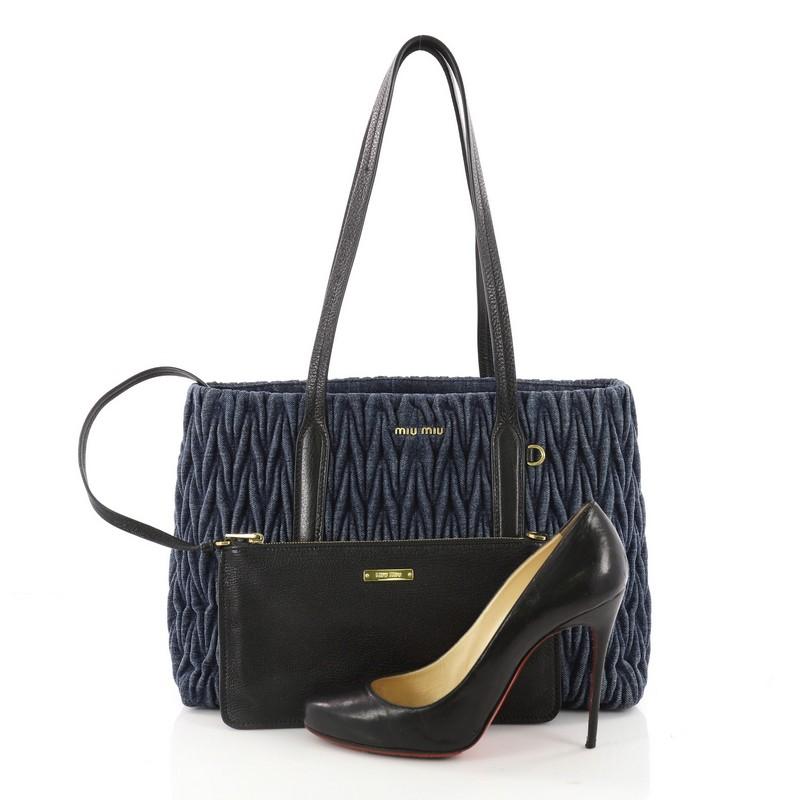 This authentic Miu Miu Open Tote Matelasse Denim Medium is an ideal, everyday accessory for the modern woman. Crafted from blue matelasse denim this no-fuss easy to carry tote features dual flat tall leather handles, raised Miu Miu logo in gold,