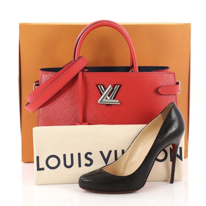 This authentic Louis Vuitton Twist Tote Epi Leather is a combination of modern lines and luxurious details. Crafted in red epi leather, this tote features two toron handles, side body straps, and silver-tone hardware accents. Its iconic twist lock