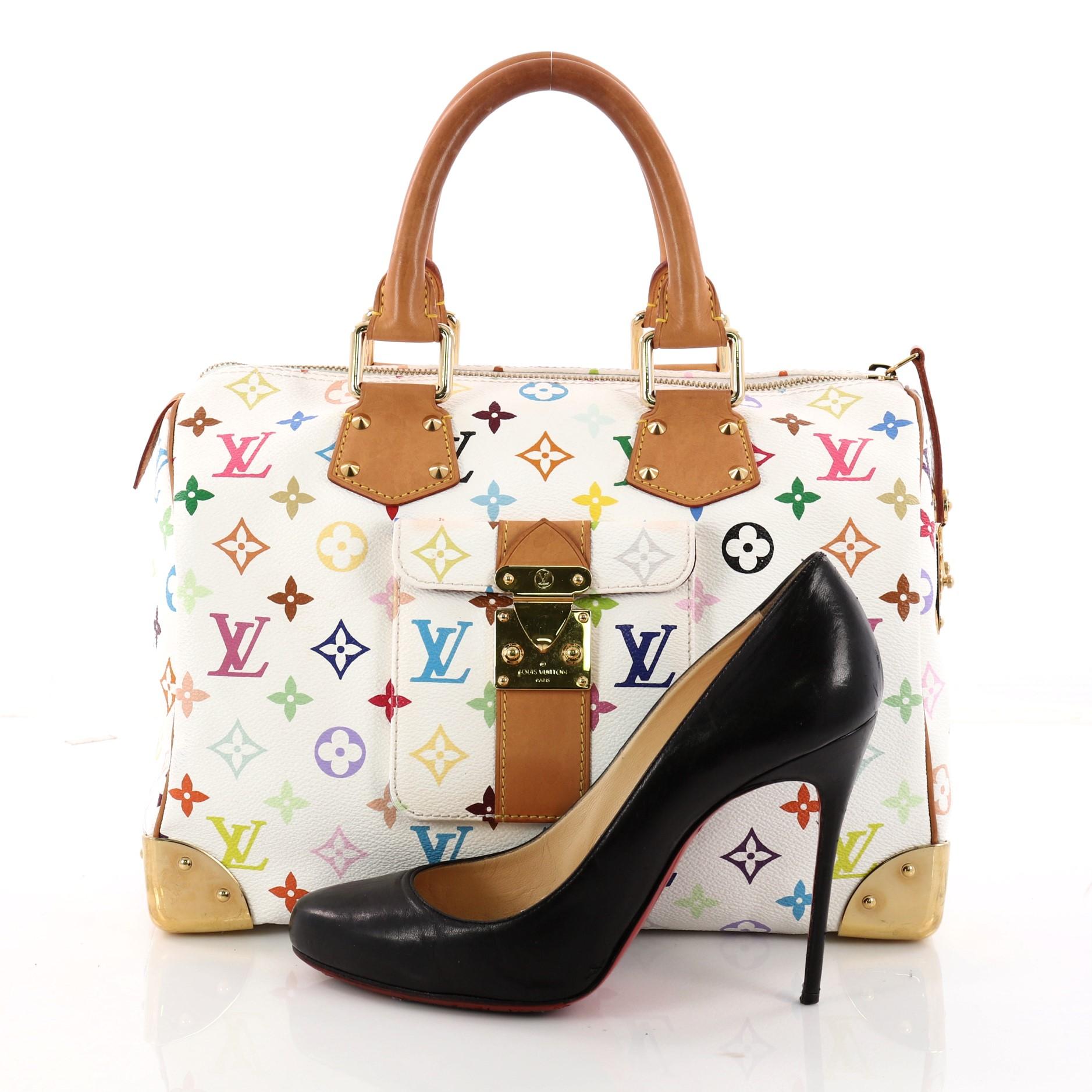 This authentic Louis Vuitton Speedy Handbag Monogram Multicolor 30 is vibrant and elegant, made for a sophisticated traveling fashionista. Crafted from Louis Vuitton’s signature white monogram multicolor coated canvas, this iconic bag features