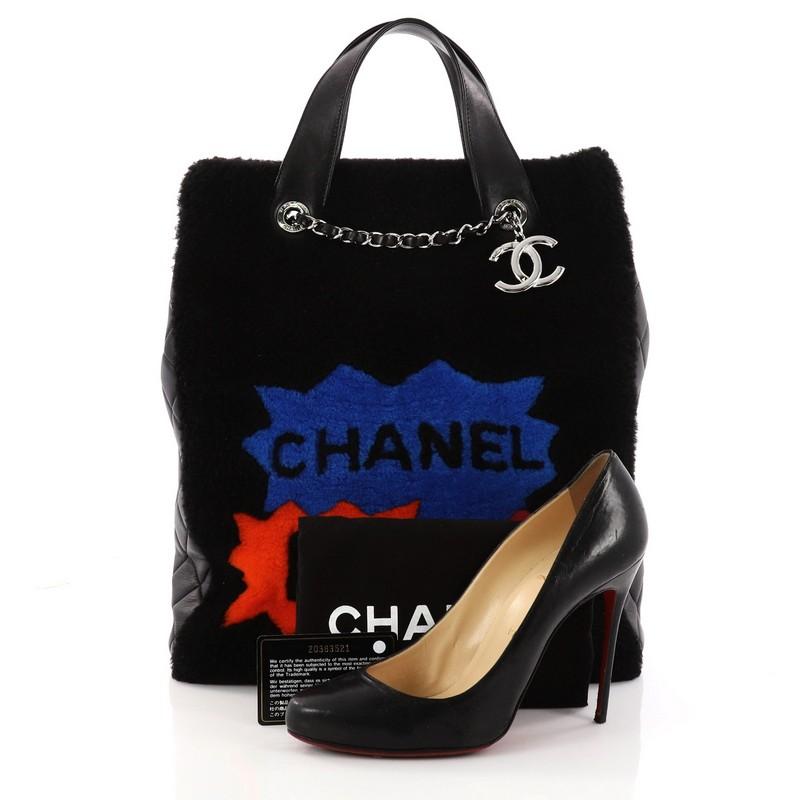 This authentic Chanel No. 5 Comic Tote Shearling Large presented in the brand's 2014 Collection boasts an avant-garde, runway-ready style made for daring fashionistas. Crafted from plush black and multicolor shearling with quilted black lambskin