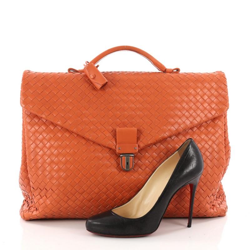 This authentic Bottega Veneta Envelope Briefcase Intrecciato Nappa Large is a classic briefcase perfect for daily or business excursions. Crafted in orange nappa leather in Bottega Veneta's signature intrecciato method, this structured yet stylish