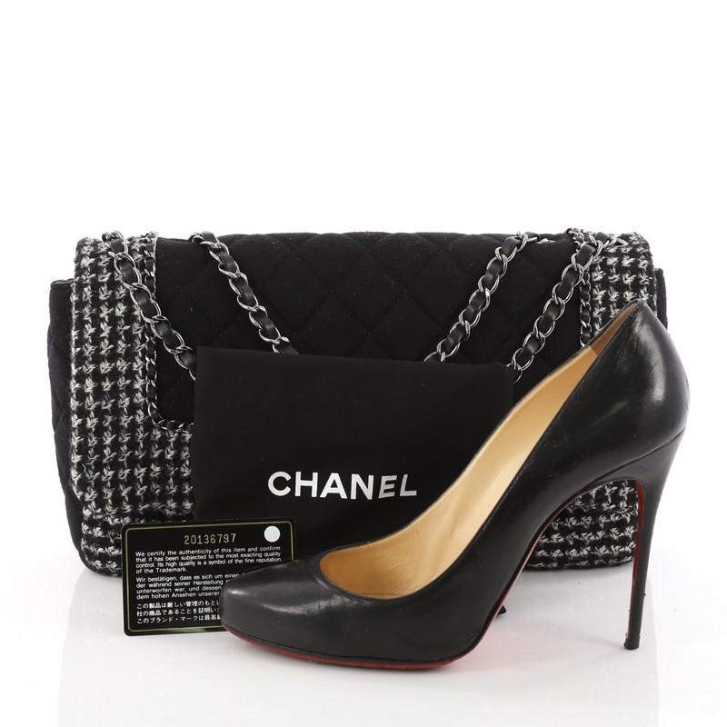 This authentic Chanel Flap with Chain Bag Quilted Tweed and Jersey Jumbo is a chic and stylish bag with a casual twist perfect for everyday excursions. Crafted in black quilted tweed and jersey, this flap bag features woven-in leather chain strap,