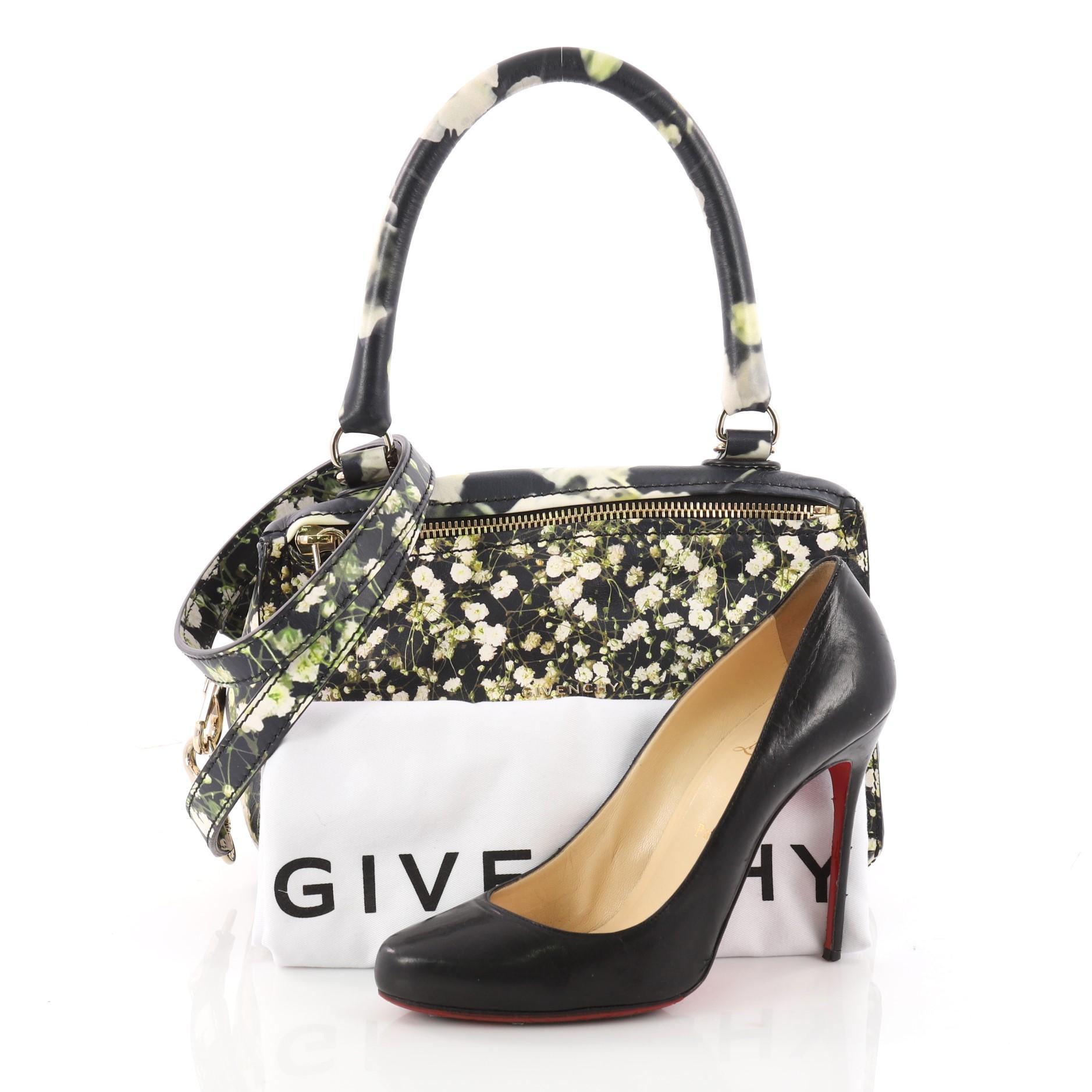 This authentic Givenchy Pandora Bag Printed Leather Small is the perfect companion bag for any on-the-go fashionista. Crafted from floral printed leather, this edgy and cult-favorite satchel features a pandora box-inspired silhouette, a singular top