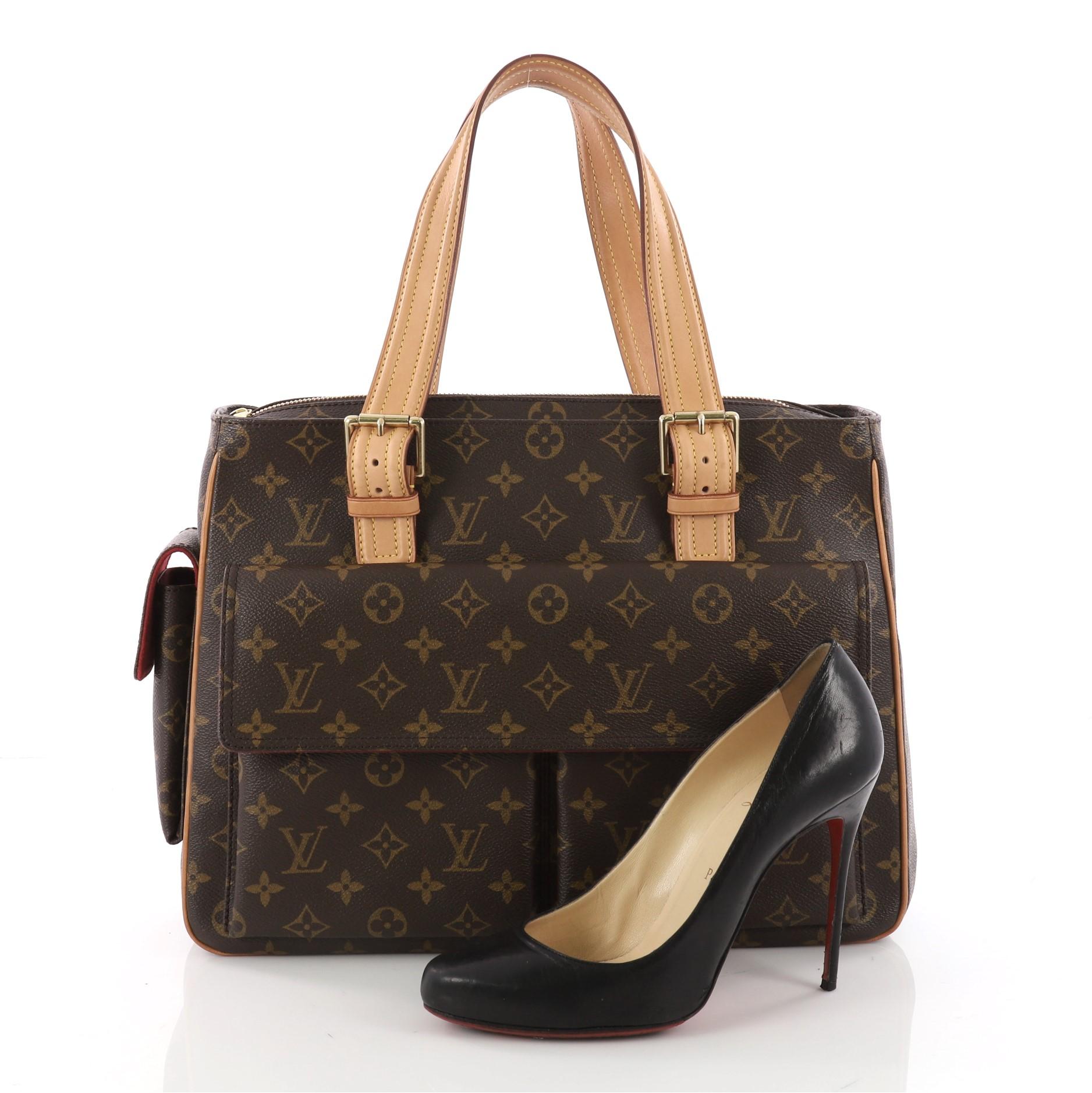 This authentic Louis Vuitton Multipli Cite Handbag Monogram Canvas showcases a simple design made for everyday use. Crafted from Louis Vuitton's iconic brown monogram coated canvas, this tote features dual flat vachetta leather straps with buckle