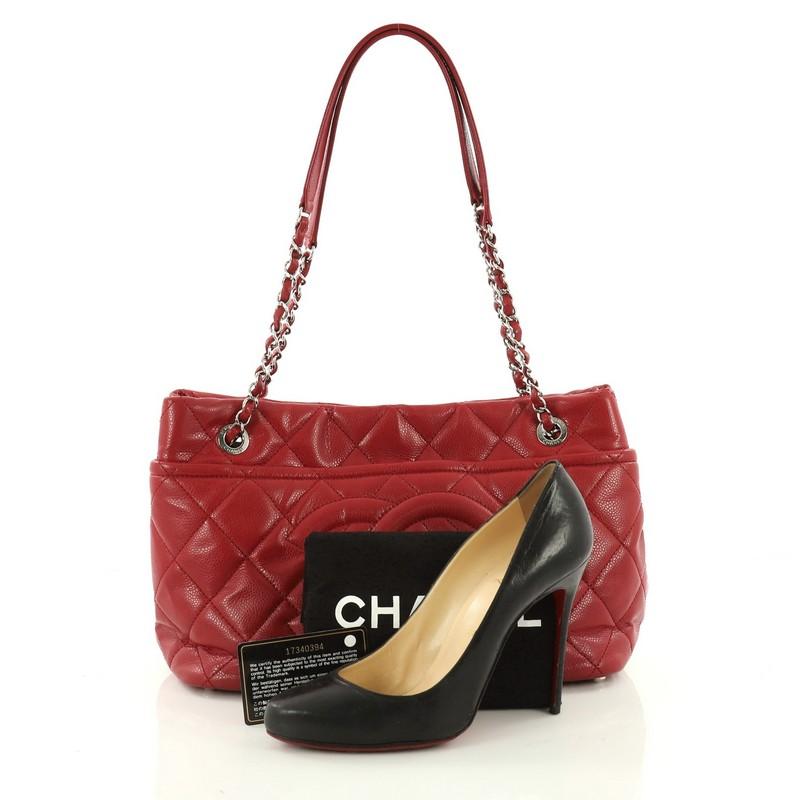 This authentic Chanel Timeless CC Soft Tote Quilted Caviar Medium showcases the brand's classic style perfect for the modern woman. Crafted from red diamond quilted caviar leather, this stylish tote features Chanel's signature oversized stitched