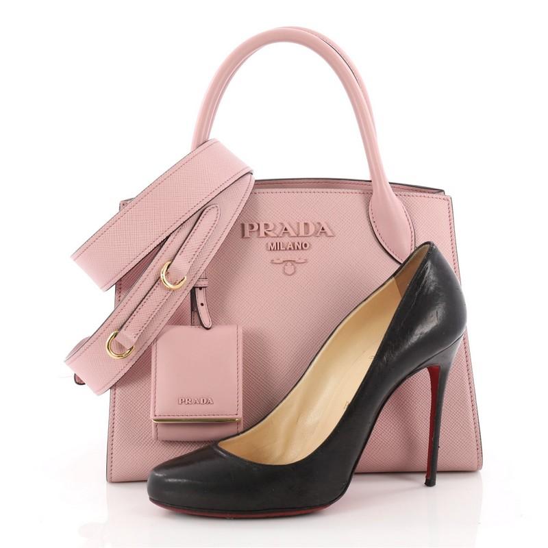 This authentic Prada Monochrome Tote Saffiano Leather with City Calfskin Small is a practical bag with personality, perfect for your daily excursions. Crafted from pale pink saffiano leather, this stylish bag features dual-rolled leather handles,