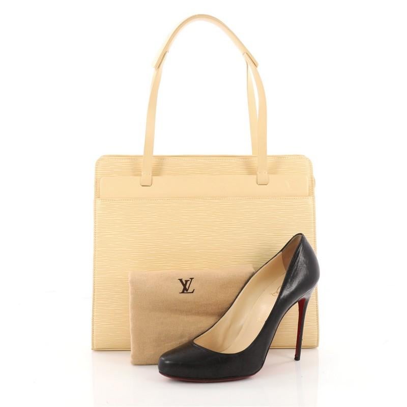 This authentic Louis Vuitton Croisette Handbag Epi Leather PM is refined and elegantly constructed ideal for everyday excursions. Crafted from Louis Vuitton's light buttercup yellow epi leather, this bag features thin leather straps, subtle LV logo