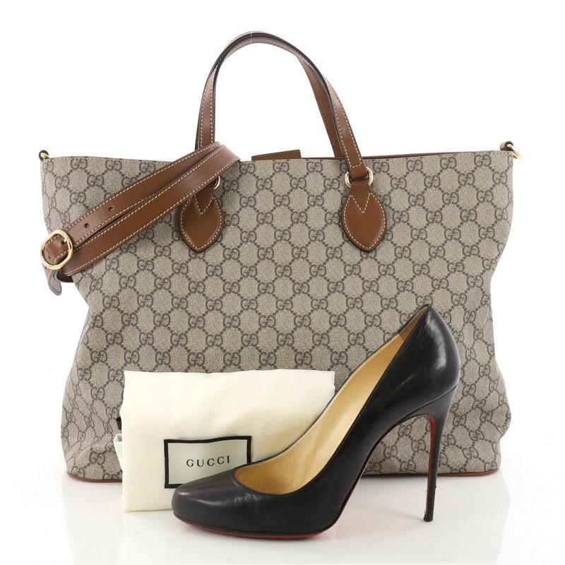 This authentic Gucci Convertible Soft Tote GG Coated Canvas Medium is a must-have tote for the modern woman. Constructed from brown GG supreme coated canvas, this bag features a soft silhouette, dual-rolled handles, and gold-tone hardware accents.