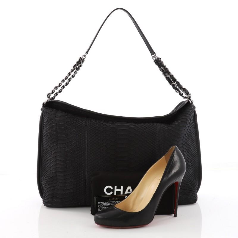 This authentic Chanel French Riviera Hobo Python Large showcases a subtly modern yet classic design made for the modern woman. Crafted in genuine black python skin, this luxurious bag features woven-in leather chain strap with leather pads, ,