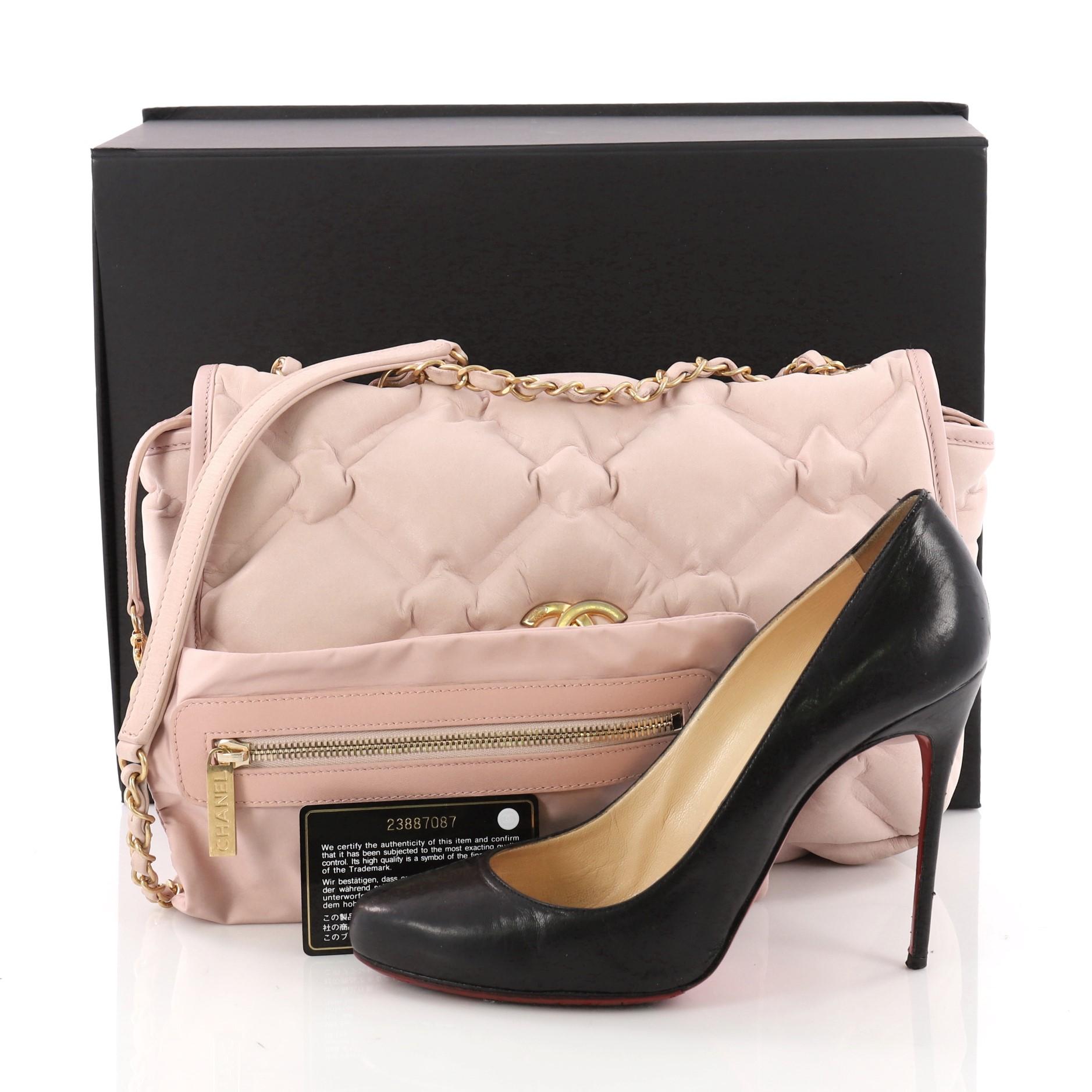 This authentic Chanel Chesterfield Flap Bag Quilted Calfskin Jumbo is a chic and stylish bag perfect for the modern fashionista. Crafted from light pink calfskin leather in chesterfield-style quilting, this flap bag features dual woven-in leather