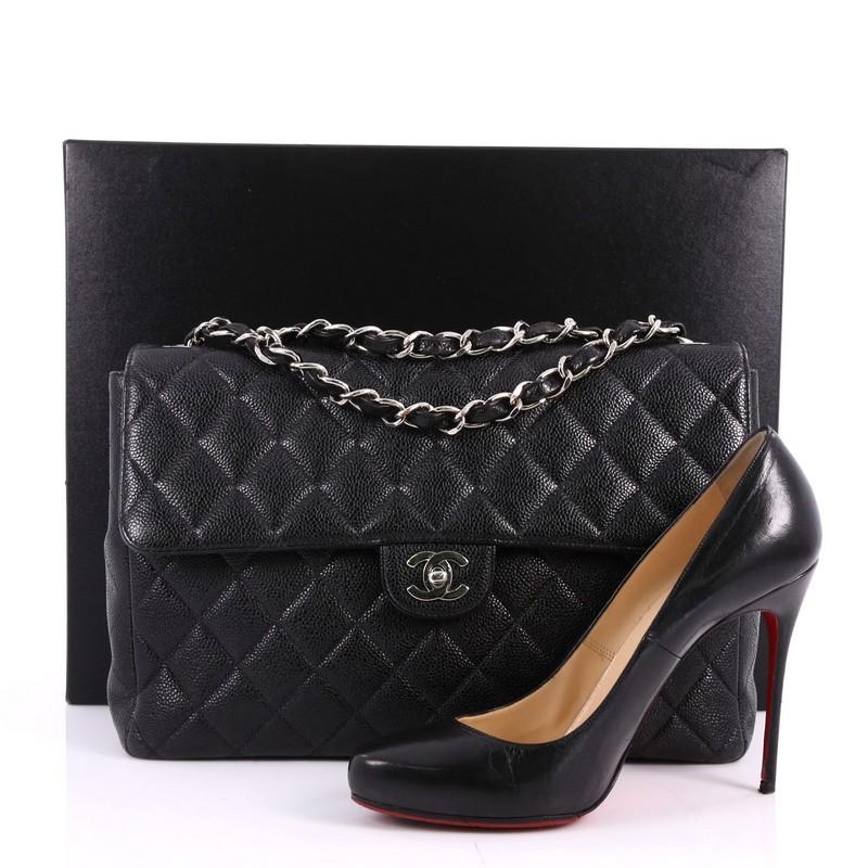 This authentic Chanel Vintage Square Classic Single Flap Bag Quilted Caviar Jumbo is timeless and chic embodying Chanel's classic design. Crafted from black caviar leather, this oversized eye-catching flap bag features a structured silhouette, CC