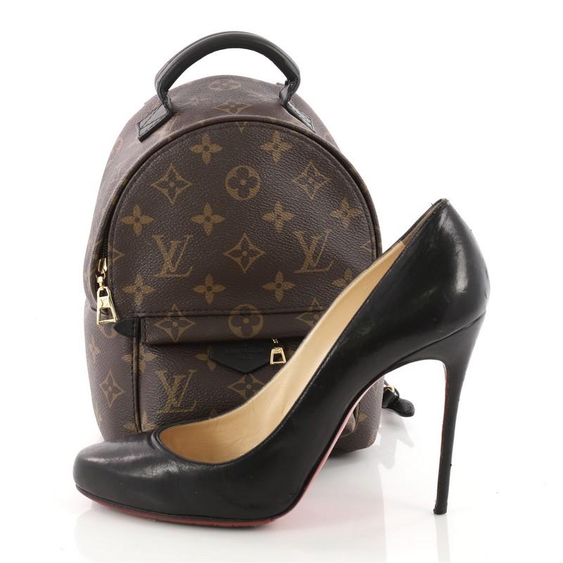 This authentic Louis Vuitton Palm Springs Backpack Monogram Canvas Mini is a stand-out piece made for care-free urban fashionistas. Crafted from brown monogram coated canvas, this chic functional backpack features a padded leather top handle,