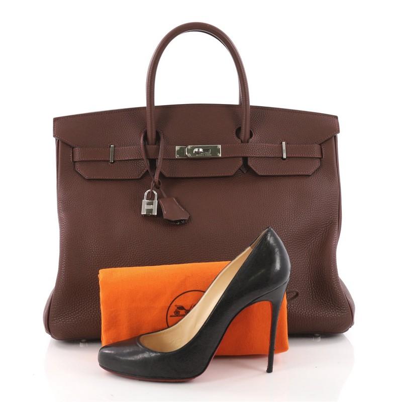 This authentic Hermes Birkin Handbag Havane Brown Togo with Palladium Hardware 40 is synonymous to traditional Hermes luxury. Crafted with sturdy, scratch-resistant Havane brown Togo leather, this eye-catching tote features dual-rolled top handles,