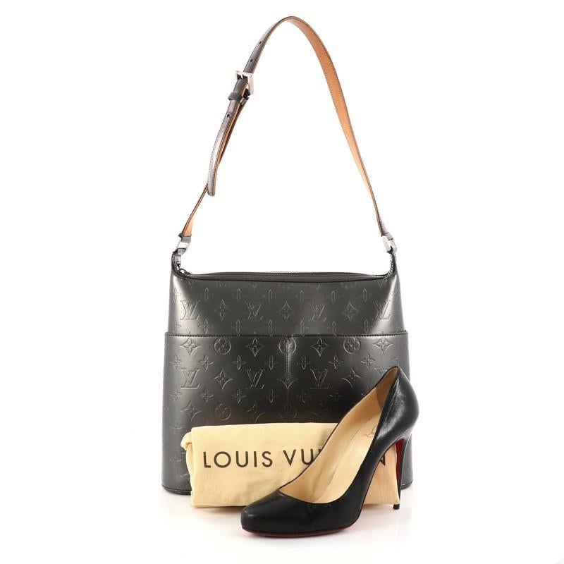 This authentic Louis Vuitton Mat Sutter Bag Monogram Vernis is sophisticated and elegant in design perfect for everyday use. Crafted in grey mat monogram vernis leather, this bag features a long strap, four exterior slip pockets and matte