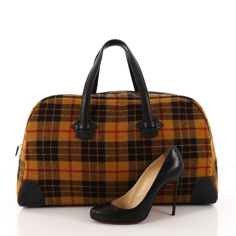 This authentic Hermes Galop Duffle Bag Multicolor Wool 50 is a practical and chic bag perfect for your travel essentials. Crafted in mustard multicolor wool, this duffle bag features dual-flat leather handles, leather trims, and gold-tone hardware