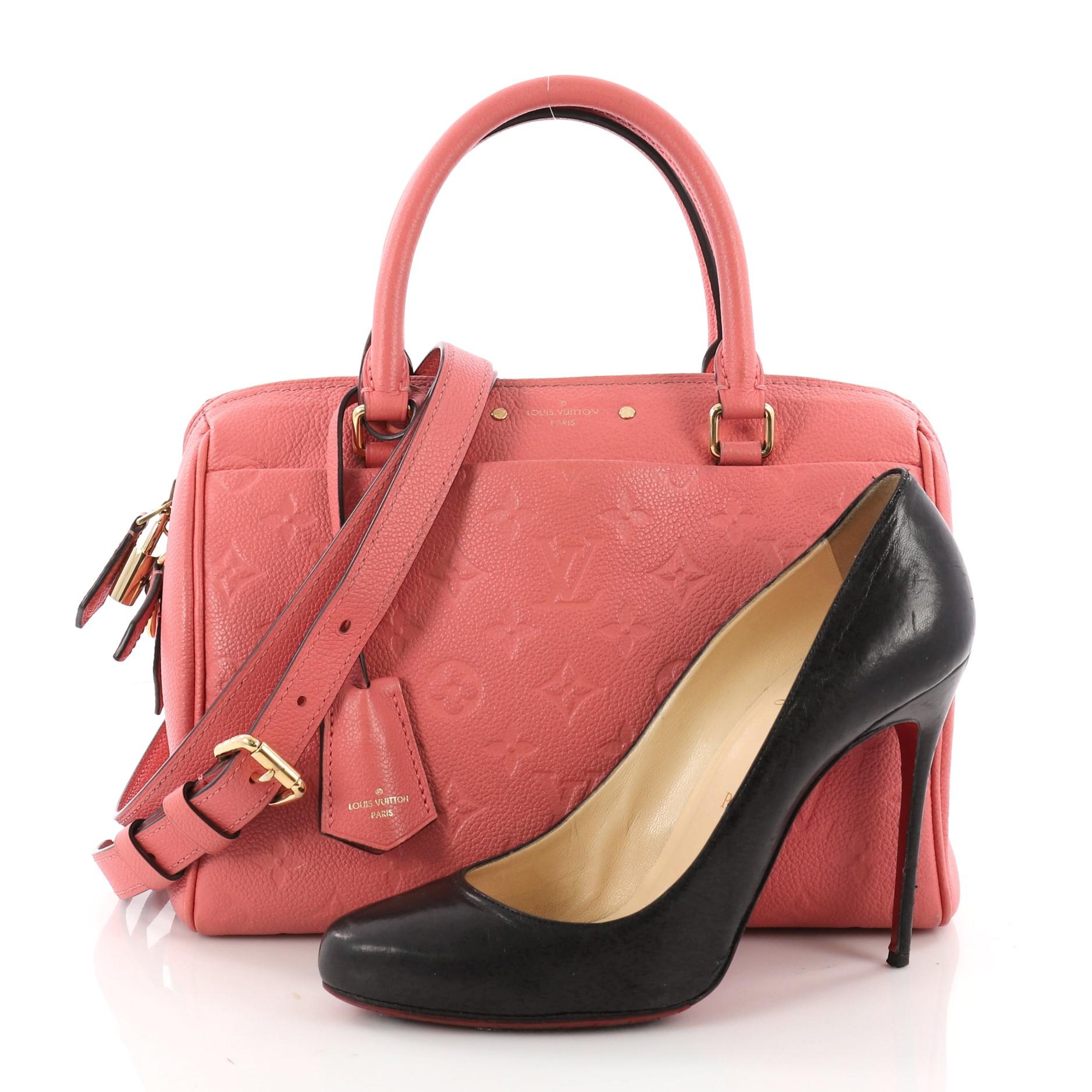 This authentic Louis Vuitton Speedy Bandouliere NM Handbag Monogram Empreinte Leather 25 is a modern must-have. Constructed from Louis Vuitton's luxurious pink monogram embossed empreinte leather, this iconic and re-imagined Speedy features