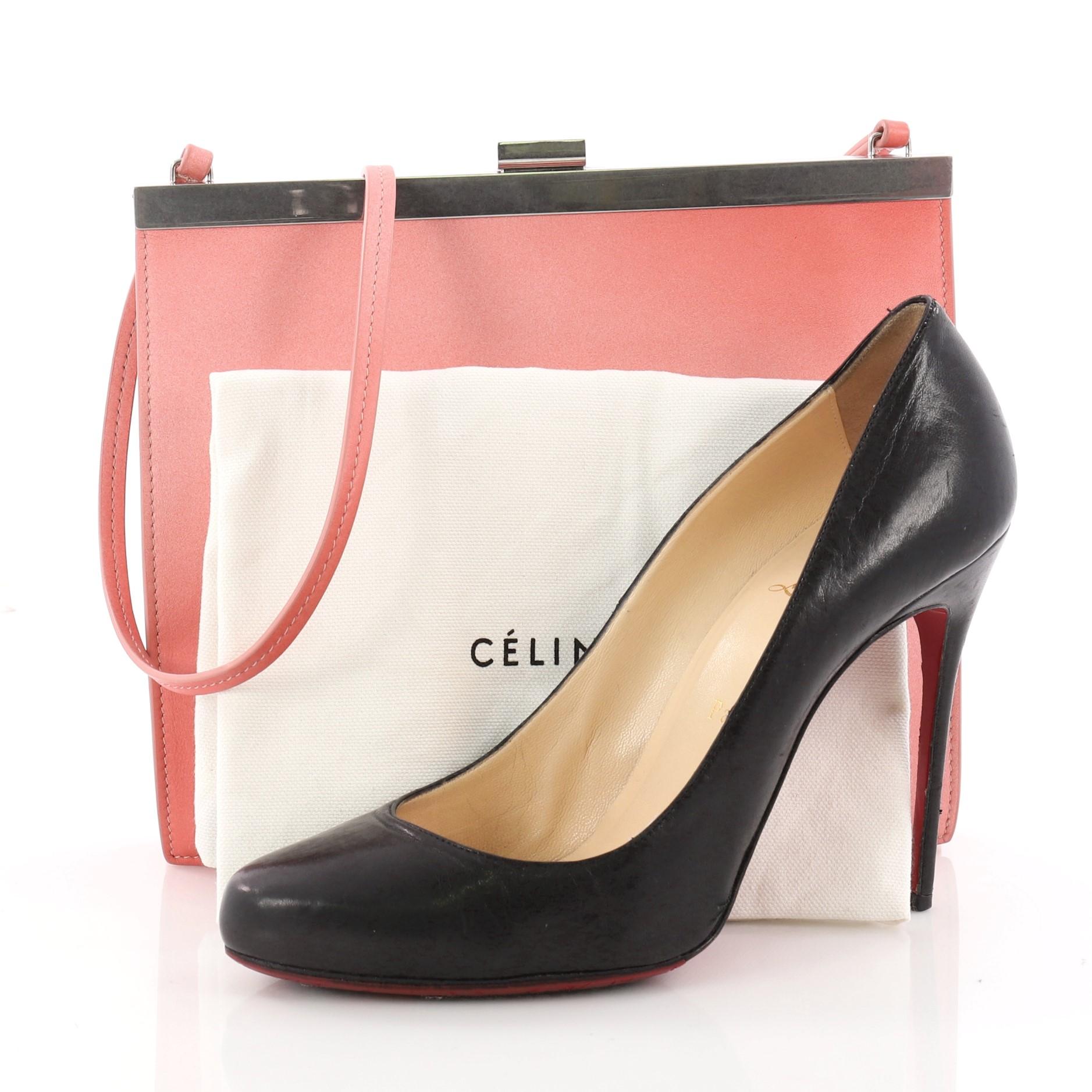 This authentic Celine Clasp Crossbody Bag Leather Mini is your ideal bag for day to night. Crafted in salmon leather, this mini bag features slip leather shoulder straps, stamped gold Celine logo, framed top, and silver-tone hardware accents. Its