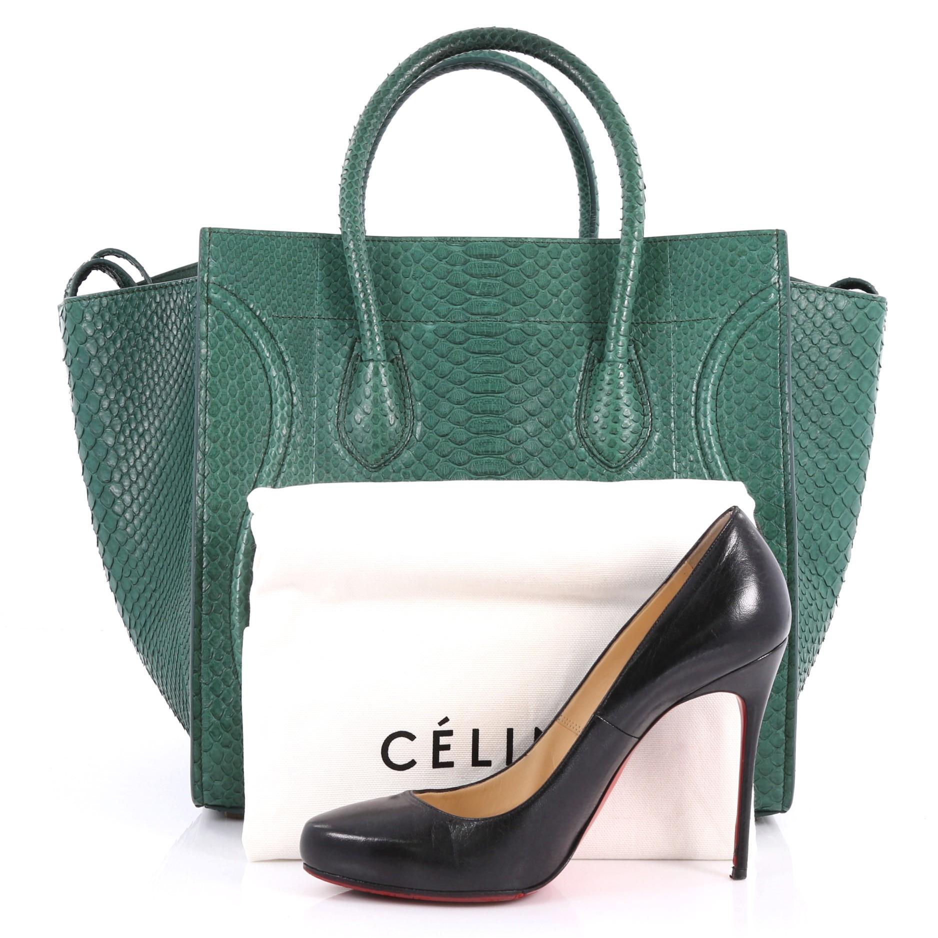 This authentic Celine Phantom Handbag Python Medium by Phoebe Philo mixes classic minimalist Celine style with casual luxe detailing. Crafted from genuine green python skin, this ultra-chic bag features exterior front zip pocket with braided zipper