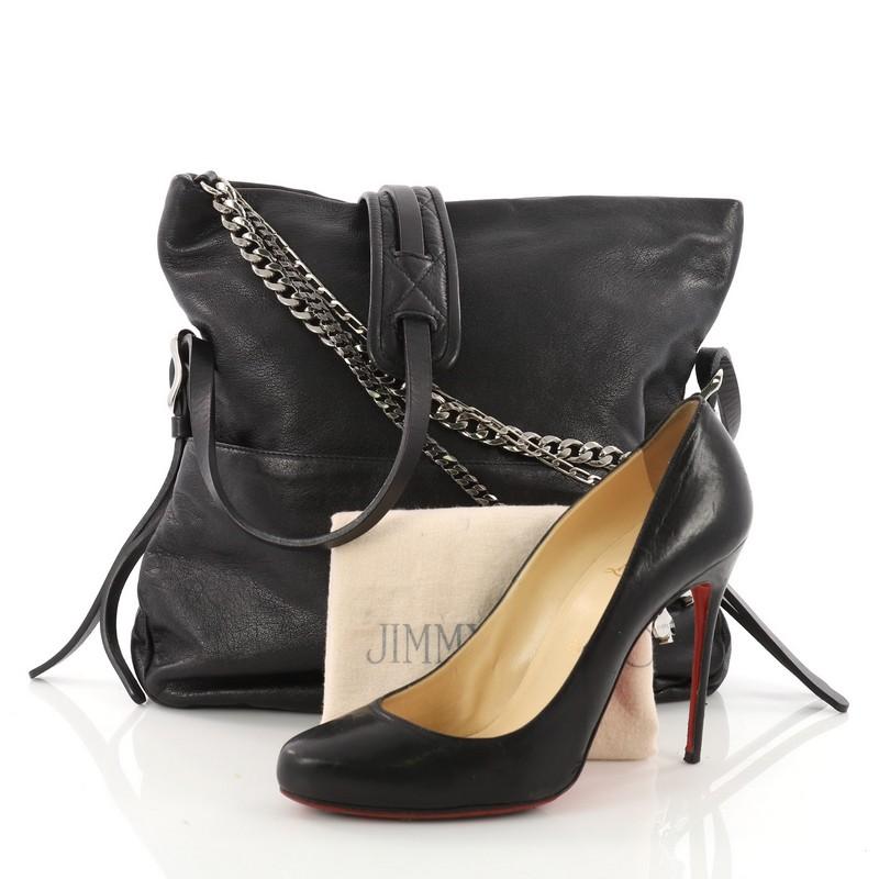 This authentic Jimmy Choo Biker Crossbody Bag Leather Small mixes casual style with a little bit of edge. Crafted in black leather, this stylish bag features a flat, adjustable shoulder strap with leather pad, zip top foldover silhouette with draped