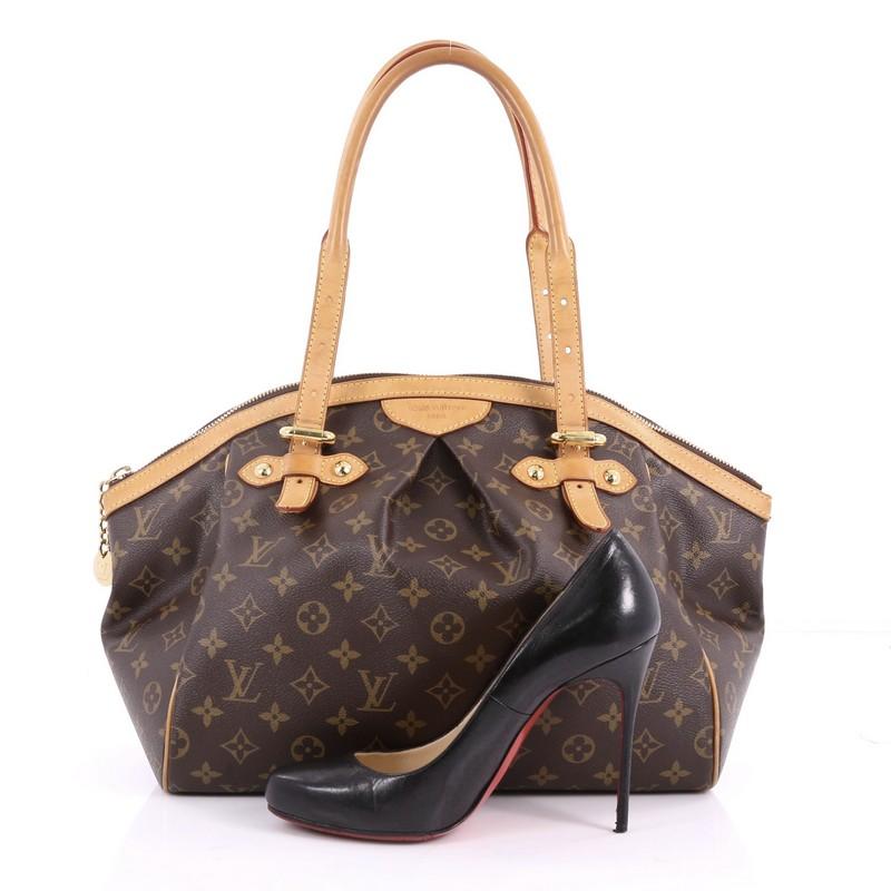 This authentic Louis Vuitton Tivoli Handbag Monogram Canvas GM inspired by the Italian city itself combines chic and feminine luxury for everyday use. Crafted from iconic brown monogram coated canvas, this tote features dual-rolled handles, cowhide