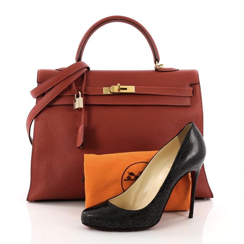 This authentic Hermes Kelly Handbag Vermillion Red Togo with Gold Hardware 35 is as classic and timeless as they come. Designed from Vermillion red togo leather, this classic style Kelly showcases Hermes' beautiful craftsmanship and devotion to