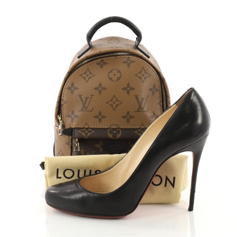 This authentic Louis Vuitton Palm Springs Backpack Reverse Monogram Canvas Mini is a standout bag made for care-free urban fashionistas. Crafted from reverse monogram coated canvas, this chic functional backpack features padded leather top handle,