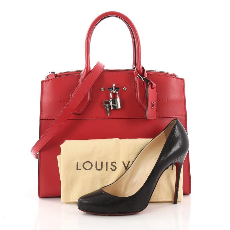 This authentic Louis Vuitton City Steamer Handbag Leather MM is a versatile bag fit for a dressy as well as a casual day out. Crafted in red leather, this modern day tote features dual-rolled leather handles, front central lock with LV stamped logo,