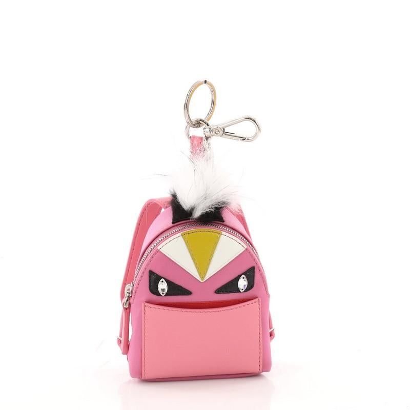 This authentic Fendi Monster Backpack Charm Nylon and Leather Micro balances a luxurious and playful style made for on-the-go fashionistas. Crafted from pink nylon, this backpack features Fendi's popular monster design in leather and fur accents,