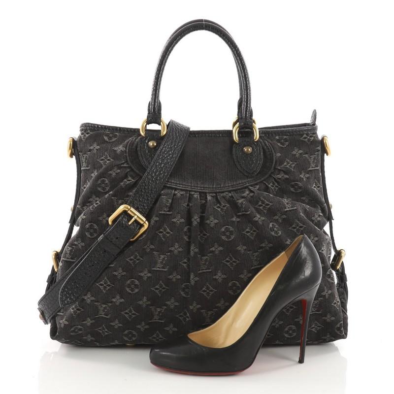 This authentic Louis Vuitton Neo Cabby Handbag Denim GM is a modern twist on the classic Louis Vuitton style. Crafted from black monogram denim, this tote features dual-rolled black leather top handles, pleated details, buckled sides, protective
