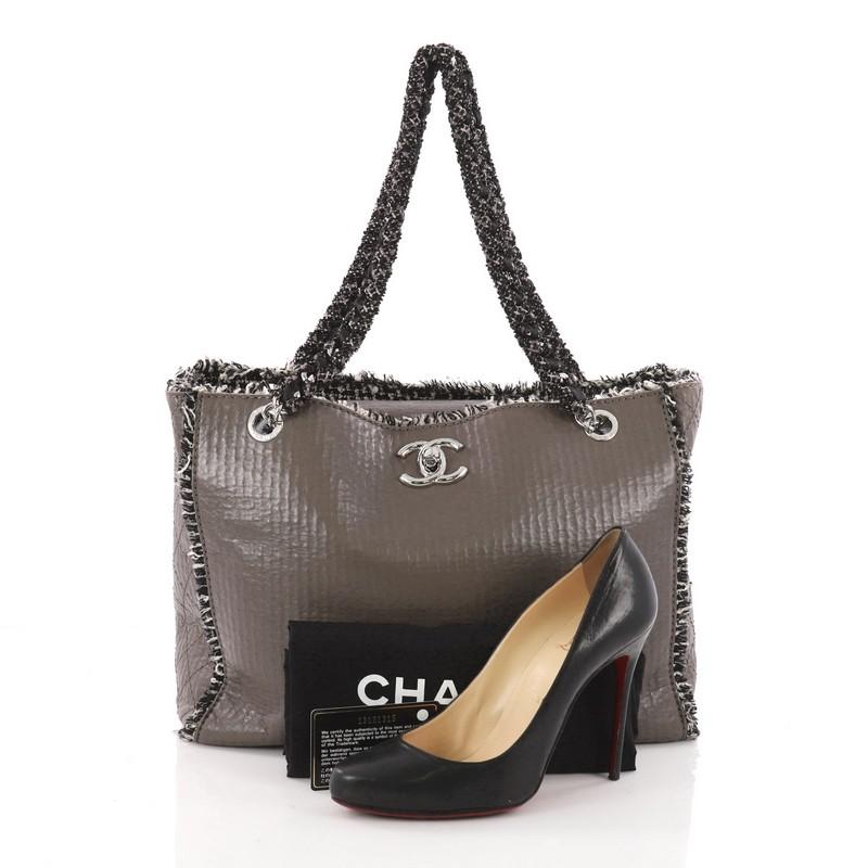 This authentic Chanel Tweedy Tote Lambskin and Tweed Large is a timeless bag perfect for your day or evening wear. Crafted from taupe lambskin leather with tweed trims, this chic tote features, dual woven-in tweed chain-link straps, CC turn-lock