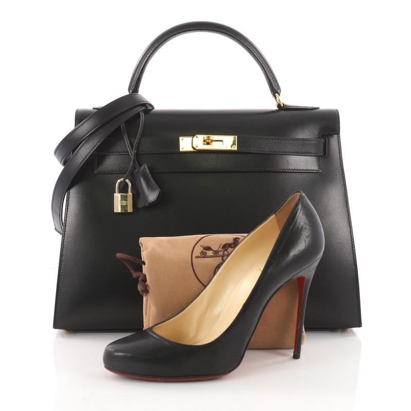 This authentic Hermes Kelly Handbag Black Box Calf with Gold Hardware 32 is as classic and timeless as they come. Designed from black box calf leather and accented with gold hardware, this Kelly showcases Hermes' beautiful craftsmanship and devotion