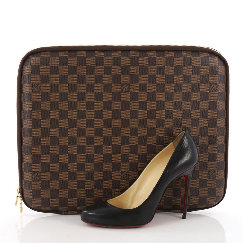 This authentic Louis Vuitton Laptop Sleeve Damier 15 is a marvelous laptop sleeve for personal and professional use. Designed from iconic damier ebene coated canvas, this slim laptop case features a zip-around closure and gold hardware accents. Its