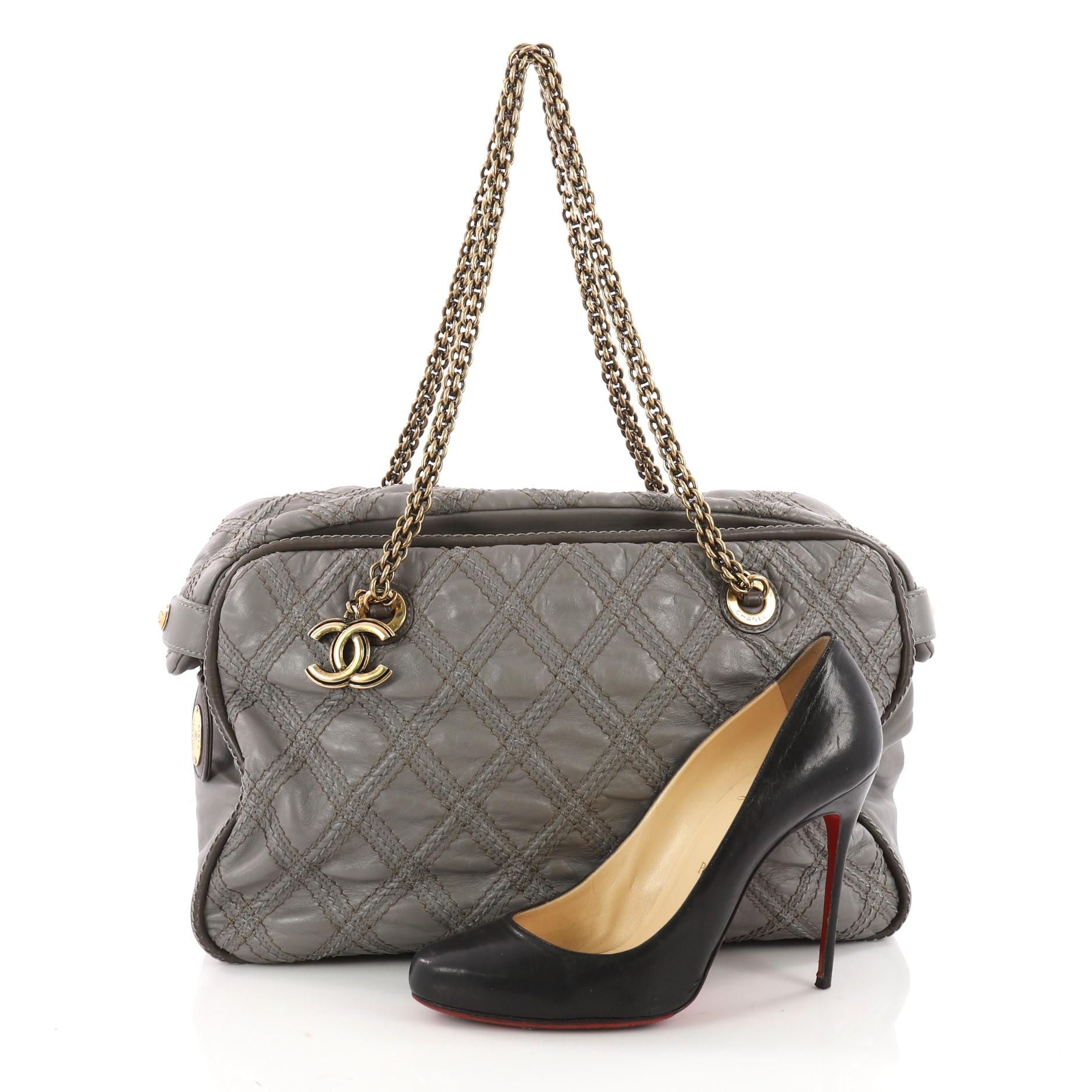 This authentic Chanel Triptych Tote Quilted Calfskin is sure to complement just about every casual outfit. Crafted from grey calfskin leather, this modern-style bag features triad diamond quilted stitching, Chanel reissue chain link straps, gray
