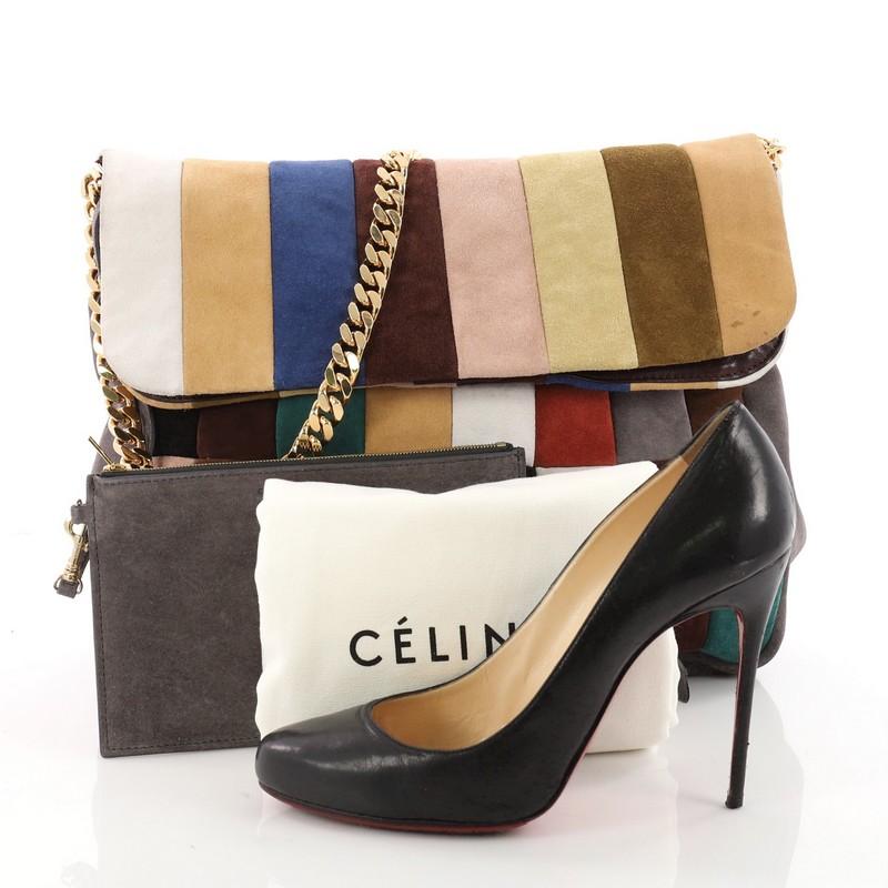 This authentic Celine Gourmette Shoulder Bag Suede Large mixes simple style with luxurious craftsmanship. Crafted from multicolor suede, this slouchy, no-fuss hobo features a large frontal flap, single gold chain strap and gold-tone hardware